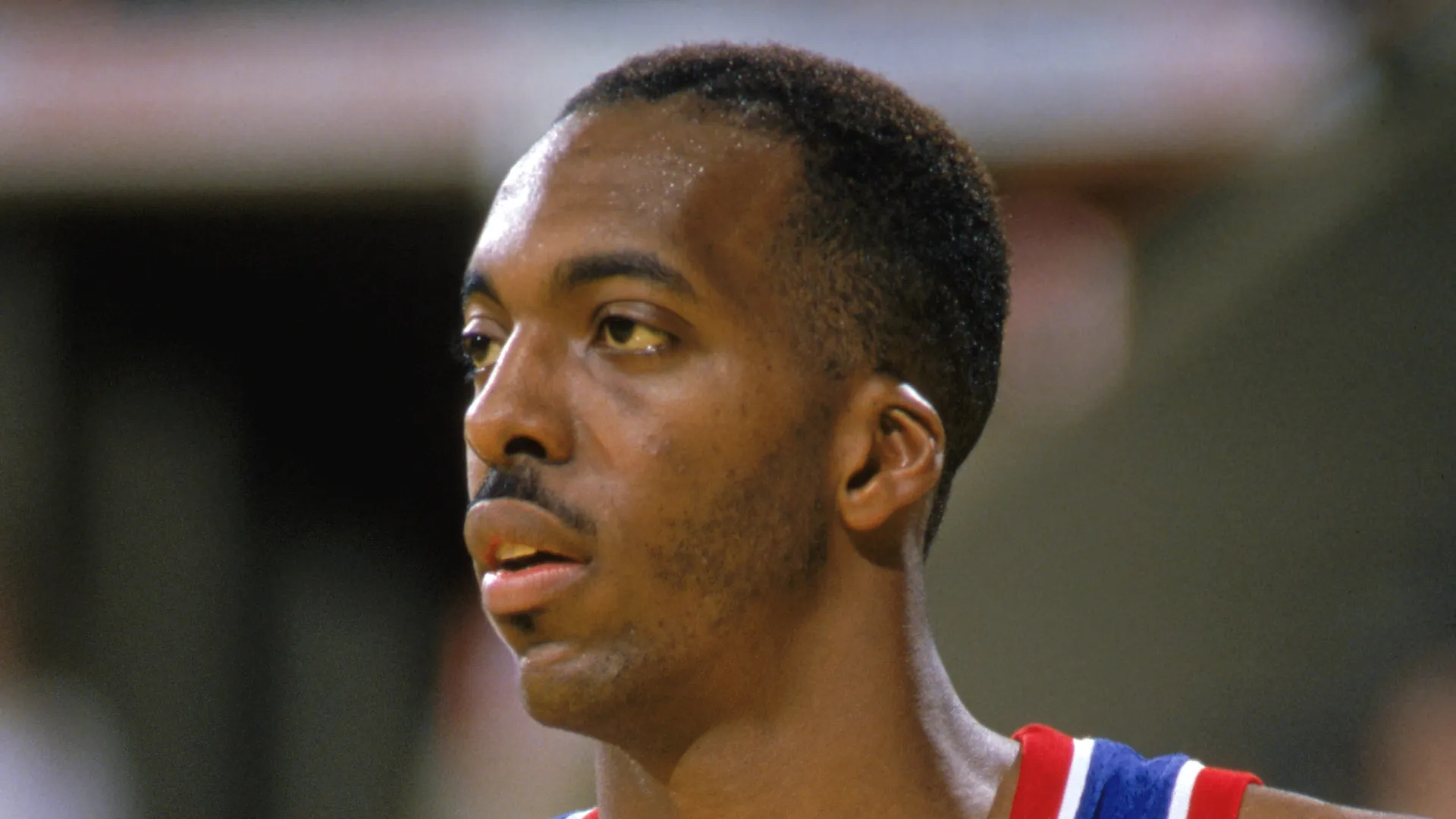 John Salley #22 of the Detroit Pistons looks on in a game during the 1989-1990 NBA season.