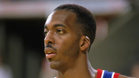 John Salley #22 of the Detroit Pistons looks on in a game during the 1989-1990 NBA season.