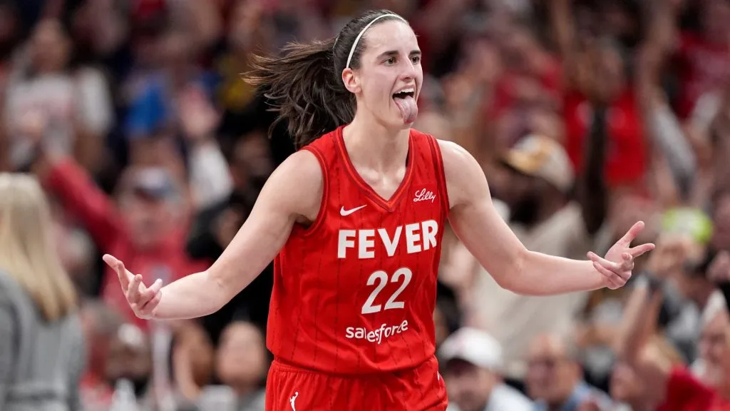 Caitlin Clark #22 of the Indiana Fever celebrates a basket during the second half of a game against the Las Vegas Aces in 2024. (Source: Emilee Chinn/Getty Images)