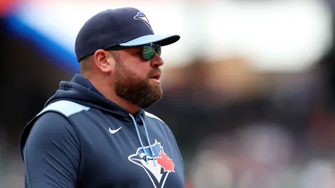 Manager John Schneider #14 of the Toronto Blue Jays takes the field for introductions before the New York Mets home opener at Citi Field on April 04, 2025 in the Flushing neighborhood of the Queens borough of New York City. The New York Mets defeated the Toronto Blue Jays 5-0.