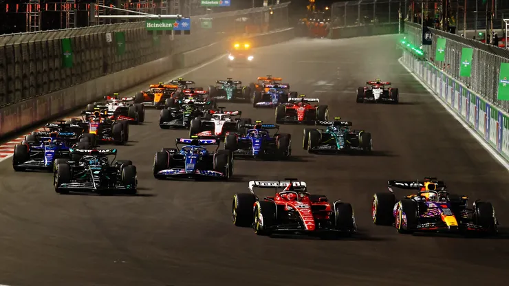 Max Verstappen of the Netherlands driving the (1) Oracle Red Bull Racing RB19 leads Charles Leclerc of Monaco driving the (16) Ferrari SF-23 at turn one during the F1 Grand Prix of Las Vegas.