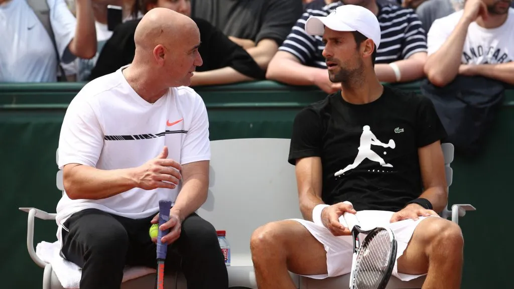 Novak Djokovic of Serbia in discussion with coach Andre Agassi during practice on day one of the 2017 French Open at Roland Garros. (Julian Finney/Getty Images)