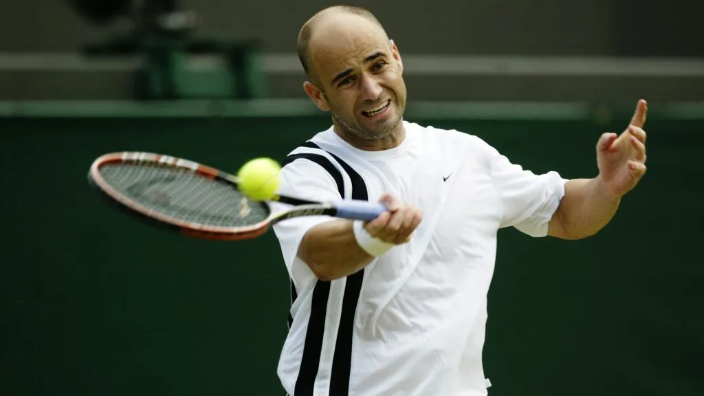 Andre Agassi of the USA plays a forehand during his victory over Lars Burgsmuller of Germany during day four of the Wimbledon Lawn Tennis Championships. (Alex Livesey/Getty Images)