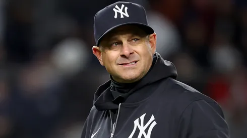 Aaron Boone #17 of the New York Yankees walks back to the dugout.
