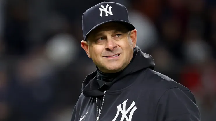 Aaron Boone #17 of the New York Yankees walks back to the dugout.