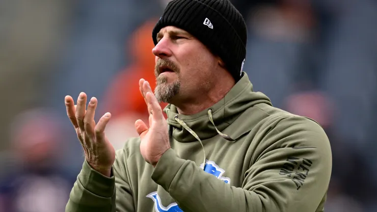Head coach Dan Campbell of the Detroit Lions watches his team warm up before their game against the Chicago Bears at Soldier Field on November 13, 2022 in Chicago, Illinois.