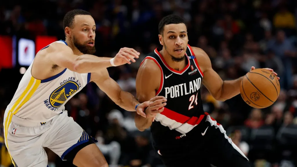 Kris Murray #24 of the Portland Trail Blazers dribbles against Stephen Curry #30 of the Golden State Warriors during the third quarter. (Alika Jenner/Getty Images)