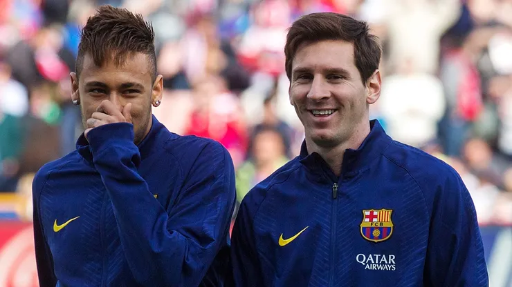 Neymar and Lionel Messi playing with Barcelona during the 2014-15 season.