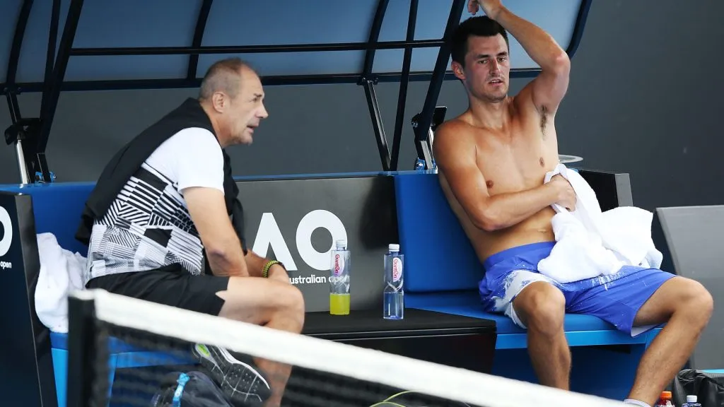 Tomic and his father John during the 2018 Australian Open (Michael Dodge/Getty Images)