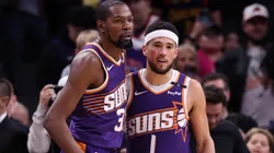 Kevin Durant #35 of the Phoenix Suns hugs Devin Booker #1 after the Suns defeated the Golden State Warriors 113-105 at Footprint Center on November 30, 2024 in Phoenix, Arizona.
