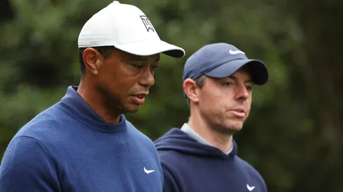 Tiger Woods of the United States and Rory McIlroy of Northern Ireland walk to the 11th fairway during a practice round prior to the 2023 Masters Tournament at Augusta National Golf Club on April 03, 2023 in Augusta, Georgia.