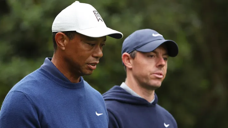 Tiger Woods of the United States and Rory McIlroy of Northern Ireland walk to the 11th fairway during a practice round prior to the 2023 Masters Tournament at Augusta National Golf Club on April 03, 2023 in Augusta, Georgia.