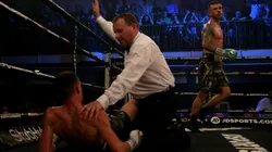 Ryan Doyle runs to the corner as the referee checks on Reece Belloti after being knocked down during the Commonwealth Featherweight Championship contest between Reece Bellotti and Ryan Doyle in 2018.