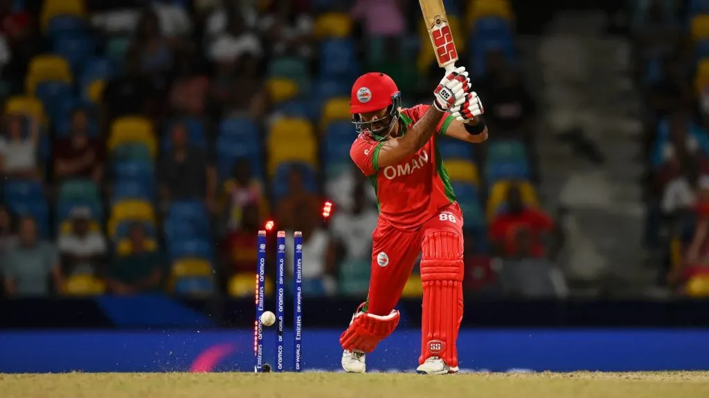 Naseem Khushi of Oman is bowled out by David Wiese of Namibia during the super over in the ICC Men’s T20 Cricket World Cup West Indies & USA 2024. (Source: Gareth Copley/Getty Images)