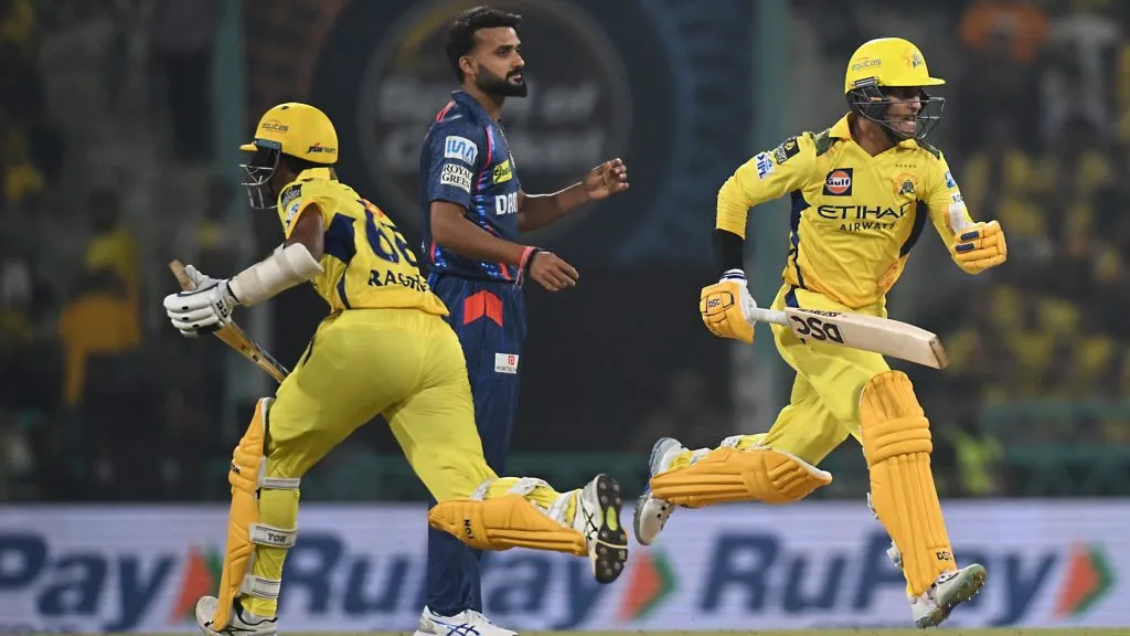 Akash Deep of Lucknow Super Giants watches as Rachin Ravindra and Shaik Rasheed of Chennai Super Kings run between the wickets during the 2025 IPL. (Source: Prakash Singh/Getty Images)