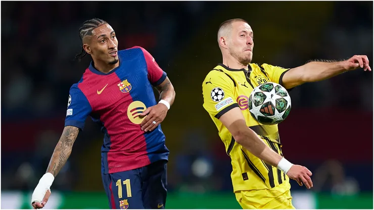 Waldemar Anton of Borussia Dortmund controls the ball whilst under pressure from Raphinha of FC Barcelona
