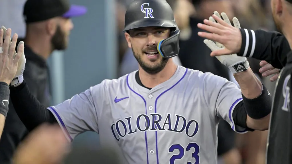 LOS ANGELES, CALIFORNIA – MAY 31: Kris Bryant #23 of the Colorado Rockies is congratulated in the dugout after scoring a run in the third inning against the Los Angeles Dodgers at Dodger Stadium on May 31, 2024 in Los Angeles, California. (Photo by Jayne Kamin-Oncea/Getty Images)