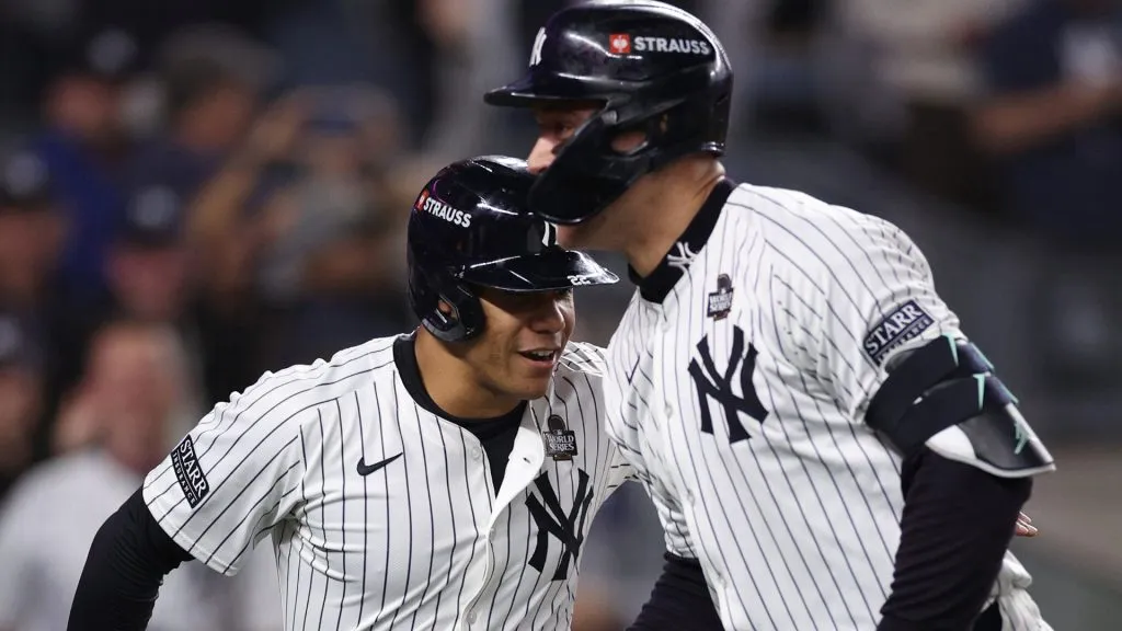 Aaron Judge #99 of the New York Yankees is congratulated by Juan Soto #22 after hitting a two-run home run during the first inning of Game Five of the 2024 World Series against the Los Angeles Dodgers at Yankee Stadium on October 30, 2024 in the Bronx borough of New York City. (Photo by Elsa/Getty Images)