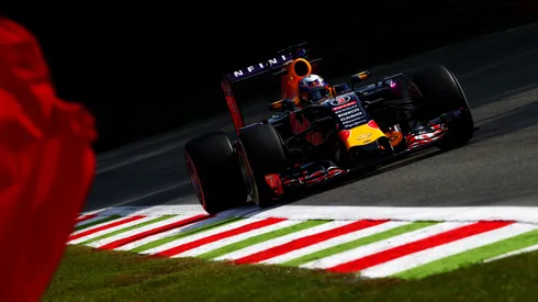 Daniel Ricciardo of Australia and Infiniti Red Bull Racing drives as a marshall waves a red flag during practice for the Formula One Grand Prix of Italy at Autodromo di Monza on September 4, 2015.