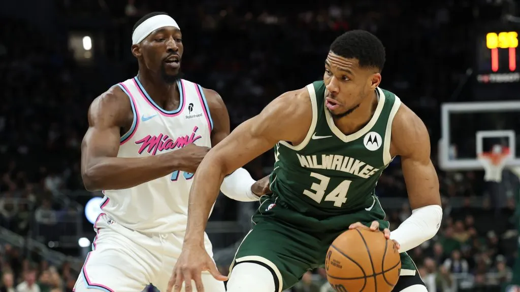 Giannis Antetokounmpo #34 of the Milwaukee Bucks is defended by Bam Adebayo #13 of the Miami Heat during a game at Fiserv Forum. (Stacy Revere/Getty Images)