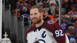 Gabriel Landeskog #92 of the Colorado Avalanche poses for a photo with Deputy Commissioner Bill Daly before the presentation of the Clarence S. Campbell Bowl after defeating the Edmonton Oilers 6-5 in overtime in Game Four of the Western Conference Final of the 2022 Stanley Cup Playoffs at Rogers Place on June 06, 2022 in Edmonton, Alberta.