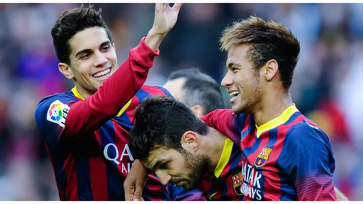 Cesc Fabregas (C) of FC Barcelona celebrates with his teammates Marc Bartra (L) and Neymar after scoring his team's second goal from the penalty spot during the La Liga match between FC Barcelona and Granda CF at Camp Nou on November 23, 2013 in Barcelona, Spain.