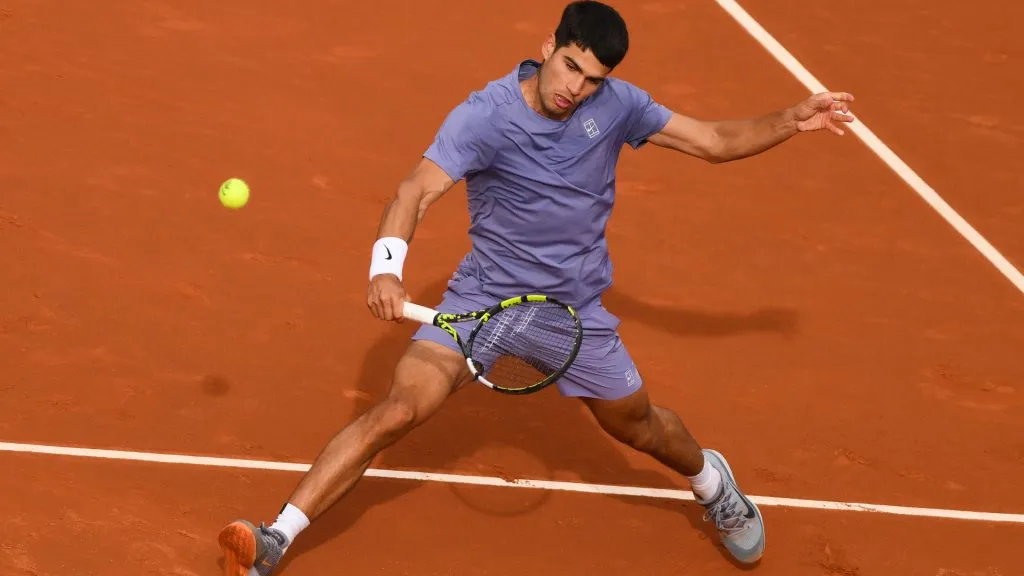 Carlos Alcaraz of Spain plays a backhand against Ethan Quinn of the United States during their match of day two of the Barcelona Open. (David Ramos/Getty Images)