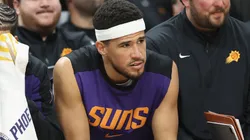 Devin Booker #1 of the Phoenix Suns reacts on the bench during the final moments of the NBA game against the San Antonio Spurs at PHX Arena on April 11, 2025 in Phoenix, Arizona.