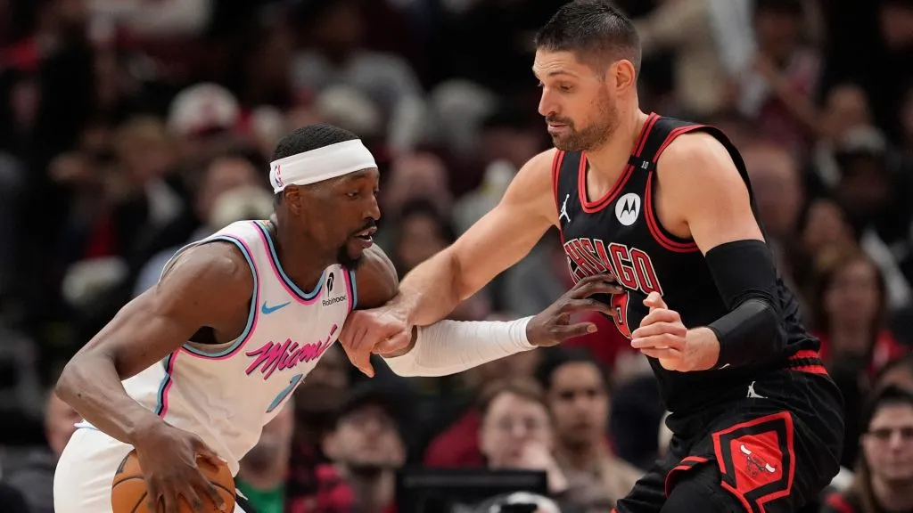 Bam Adebayo #13 of the Miami Heat dribbles the ball against Nikola Vucevic #9 of the Chicago Bulls during the fourth quarter at the United Center on April 09, 2025 in Chicago, Illinois.
