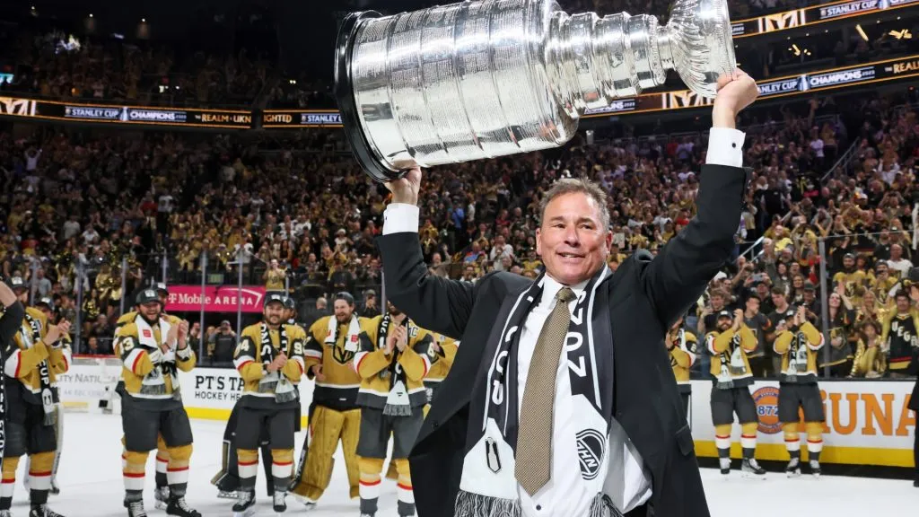 Head coach Bruce Cassidy of the Vegas Golden Knights hoists the Stanley Cup after defeating the Florida Panthers to win the championship in Game Five of the 2023 NHL Stanley Cup Final. (Source: Bruce Bennett/Getty Images)