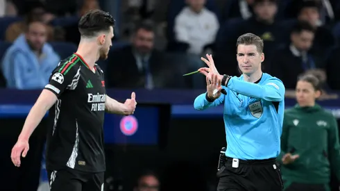 Referee Francois Letexier gestures to overturn the yellow card for Declan Rice of Arsenal and penalty earlier awarded to Real Madrid following a VAR check