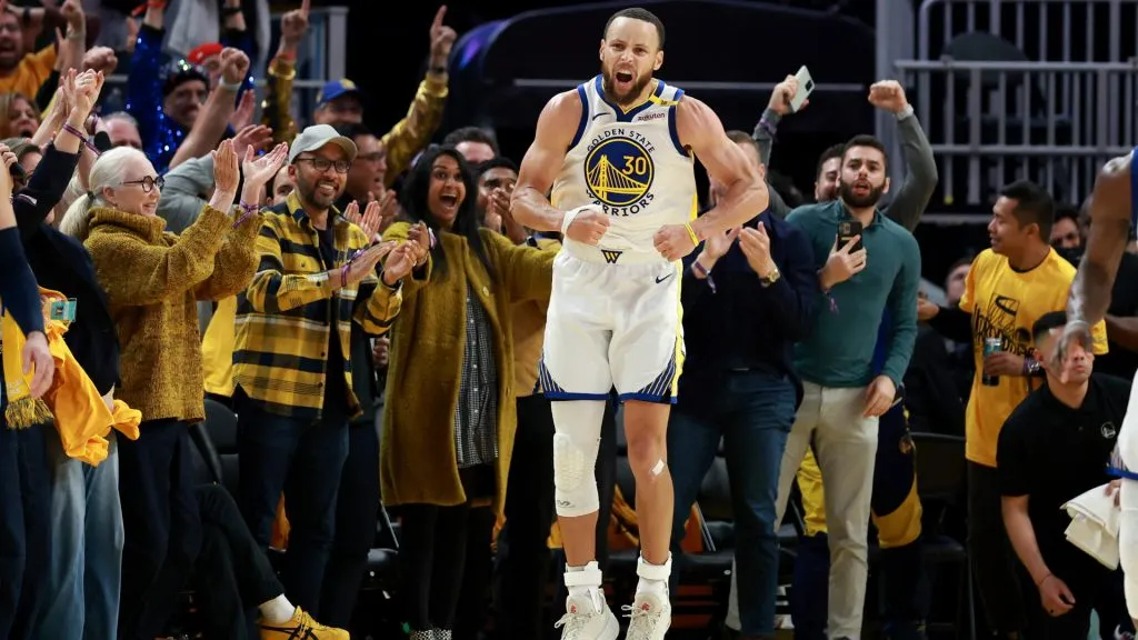 Stephen Curry #30 of the Golden State Warriors reacts after making a basket against the Memphis Grizzlies in the second half of the NBA play-in tournament game. (Ezra Shaw/Getty Images)