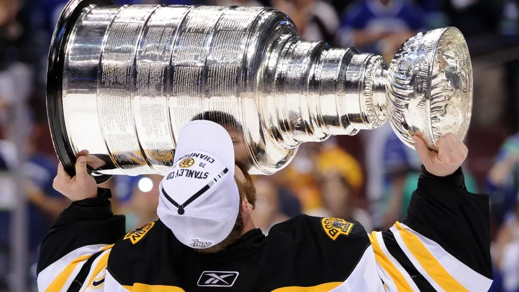Tim Thomas #30 of the Boston Bruins kisses the Stanley Cup after defeating the Vancouver Canucks in Game Seven of the 2011 NHL Stanley Cup Final. (Source: Harry How/Getty Images)