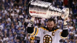 Zdeno Chara #33 of the Boston Bruins celebrates with the Stanley Cup after defeating the Vancouver Canucks in Game Seven of the 2011 NHL Stanley Cup Final.