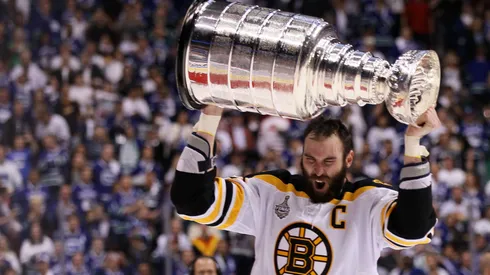 Zdeno Chara #33 of the Boston Bruins celebrates with the Stanley Cup after defeating the Vancouver Canucks in Game Seven of the 2011 NHL Stanley Cup Final.