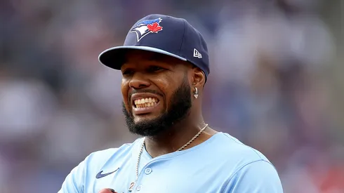 Vladimir Guerrero Jr. #27 of the Toronto Blue Jays interacts with the New York Mets dugout during the home opener at Citi Field on April 04, 2025 in the Flushing neighborhood of the Queens borough of New York City. (Photo by Elsa/Getty Images)