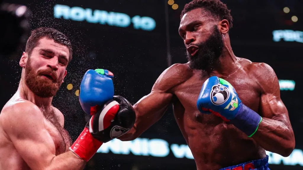 Jaron Ennis punches Karen Chukhadzhian in their Interim IBF Welterweight Championship bout. (Photo by Patrick Smith/Getty Images)