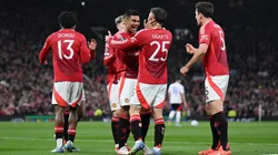 Manuel Ugarte of Manchester United celebrates scoring his team's first goal with teammate Casemiro during the UEFA Europa League 2024/25 Quarter Final Second Leg match between Manchester United and Olympique Lyonnais.