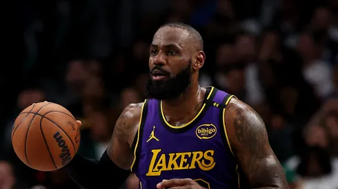 LeBron James #23 of the Los Angeles Lakers dribbles the ball against the Dallas Mavericks