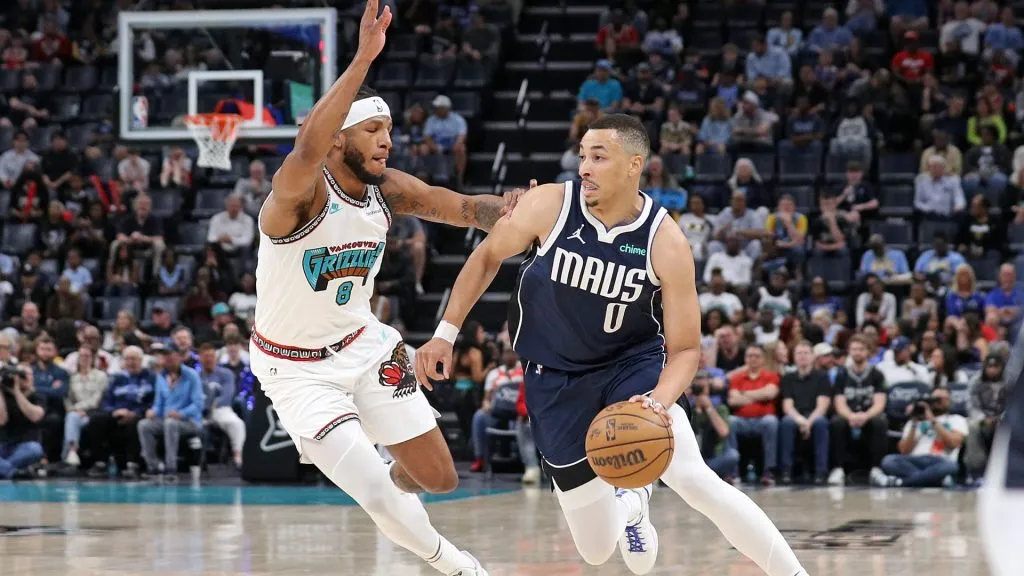 Dante Exum #0 of the Dallas Mavericks handles the ball against Lamar Stevens #8 of the Memphis Grizzlies during the first half at FedExForum. (Justin Ford/Getty Images)
