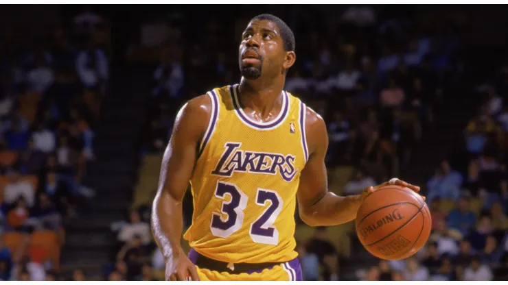 Magic Johnson #32 of the Los Angeles Lakers dribbles the ball during an NBA game at the Great Western Forum in Los Angeles, California in 1988.