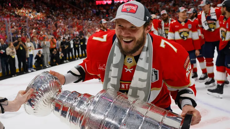 Dmitry Kulikov #7 of the Florida Panthers celebrates with the Stanley Cup following a 2-1 victory over the Edmonton Oilers in Game Seven of the 2024 NHL Stanley Cup Final.