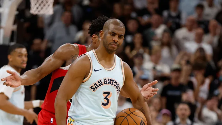 Chris Paul #3 of the San Antonio Spurs stares down Scottie Barnes #4 of the Toronto Raptors