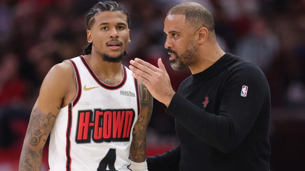 Jalen Green of the Houston Rockets speaks with head coach Ime Udoka during a game against the Minnesota Timberwolves on December 27, 2024.