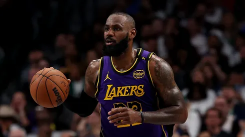 LeBron James #23 of the Los Angeles Lakers dribbles the ball against the Dallas Mavericks