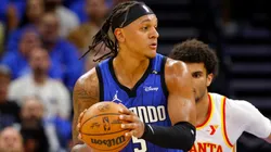 Paolo Banchero #5 of the Orlando Magic posts up Zaccharie Risacher #10 of the Atlanta Hawks during the first half of an NBA play-in tournament game at Kia Center on April 15, 2025 in Orlando, Florida.