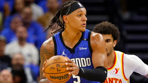 Paolo Banchero #5 of the Orlando Magic posts up Zaccharie Risacher #10 of the Atlanta Hawks during the first half of an NBA play-in tournament game at Kia Center on April 15, 2025 in Orlando, Florida.