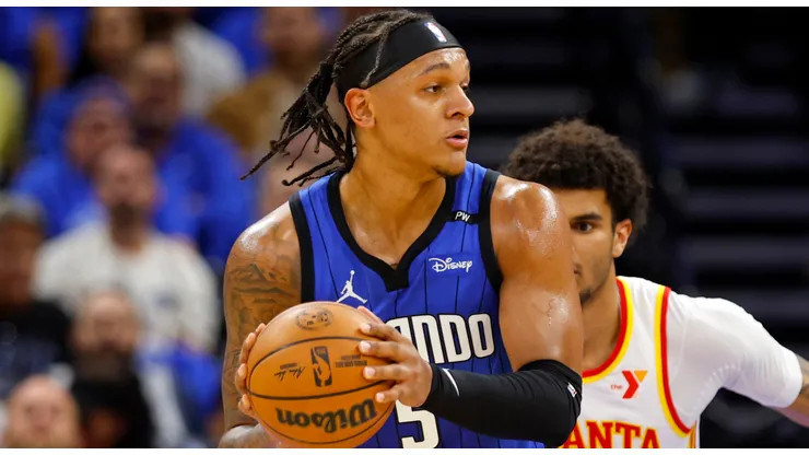Paolo Banchero #5 of the Orlando Magic posts up Zaccharie Risacher #10 of the Atlanta Hawks during the first half of an NBA play-in tournament game at Kia Center on April 15, 2025 in Orlando, Florida.