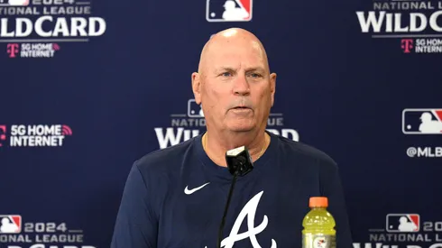 Manager Brian Snitker #43 of the Atlanta Braves speaks to the media during a press conference.