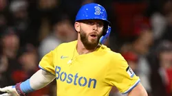 Trevor Story #10 high-fives Kristian Campbell #28 of the Boston Red Sox after scoring a run against the Chicago White Sox during the third inning at Fenway Park on April 18, 2025 in Boston, Massachusetts.